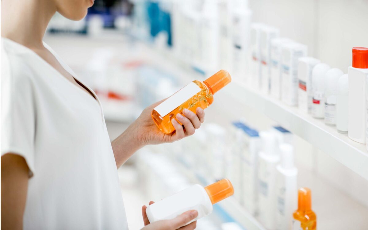 Taking,Sunscreen,Lotion,From,The,Shelves,Of,The,Pharmacy,Store,