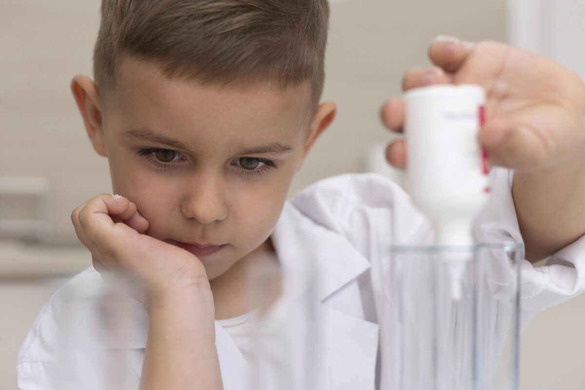 little-boy-doing-science-experiment-school